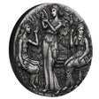 Decorative medallion with three figures in classical attire on a white background
