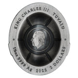 Silver coin with King Charles III's portrait and text