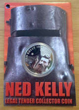 Coin with Ned Kelly design on a red and black background